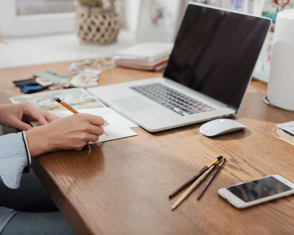 Accoutant planning tax advice on a laptop at a desk