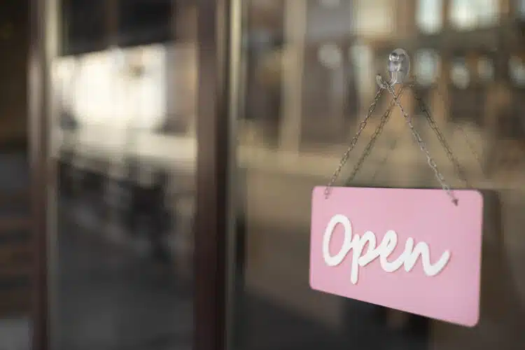 pink open sign on shop window