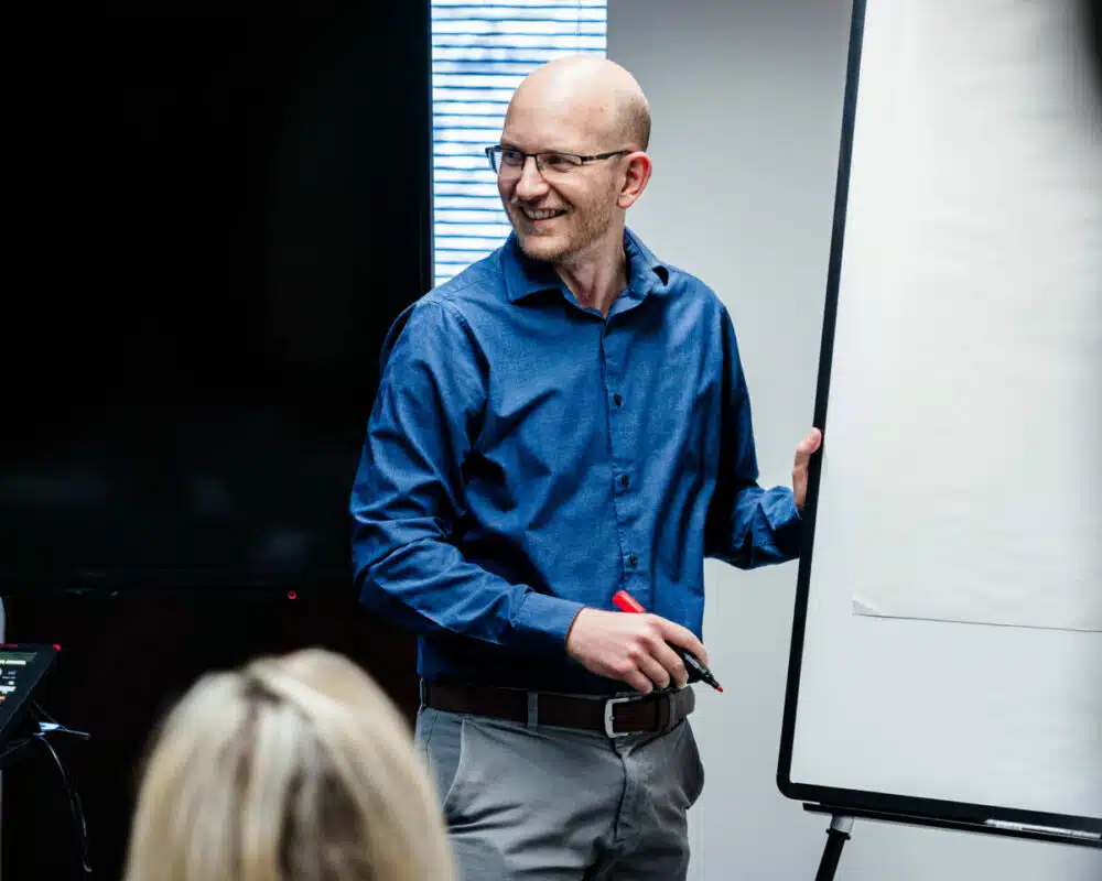 Accountant presenting by a flip board