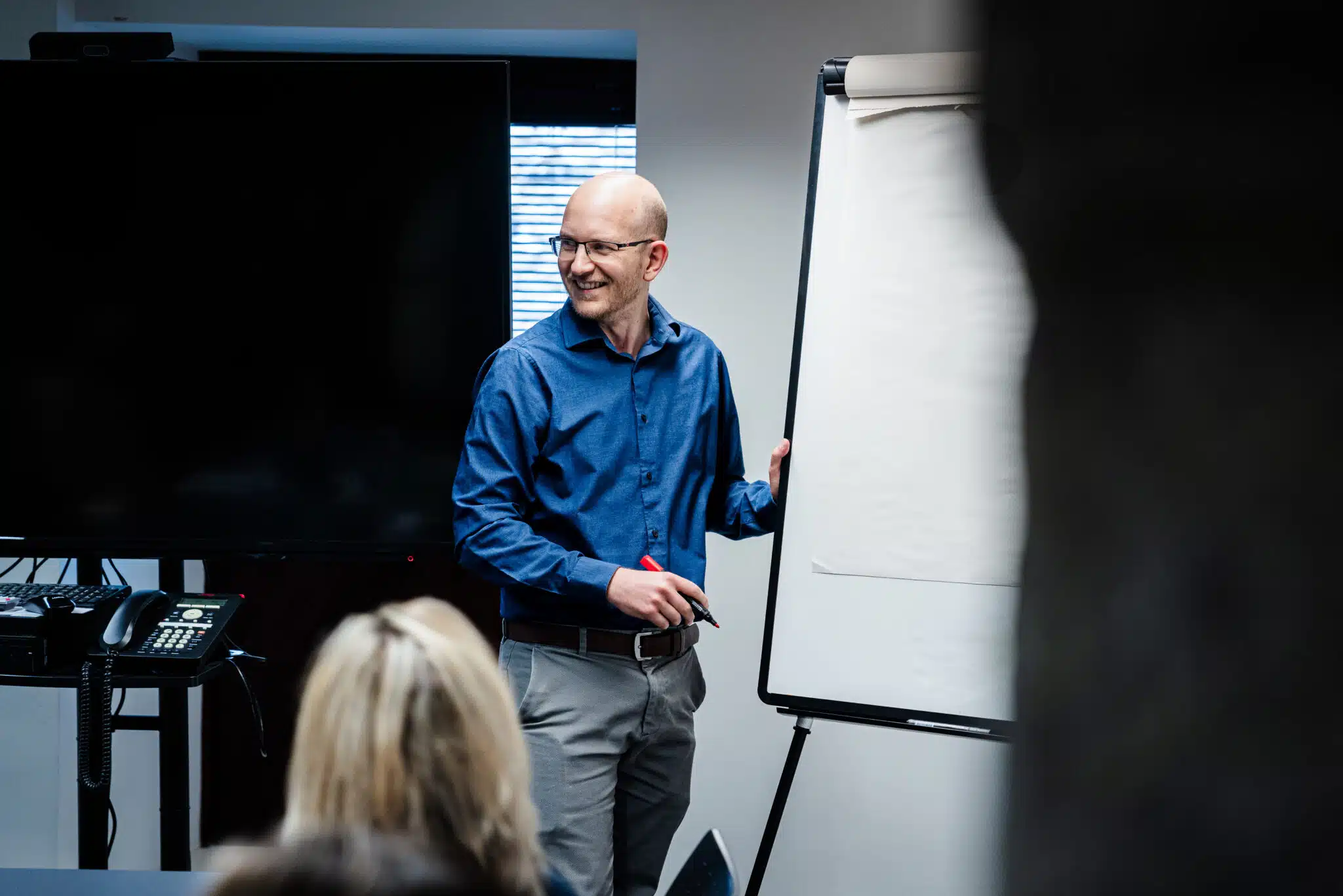 Accountant presenting by a flip board