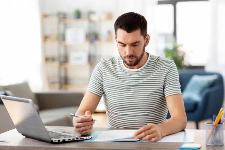 a man working on his account expenses